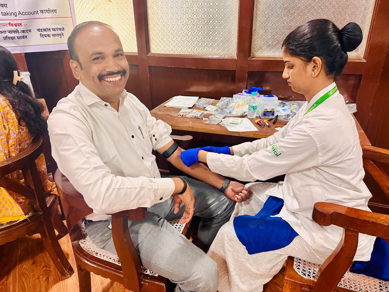 High Court employee undergoing on-site diagnostic screening at Metropolis health camp