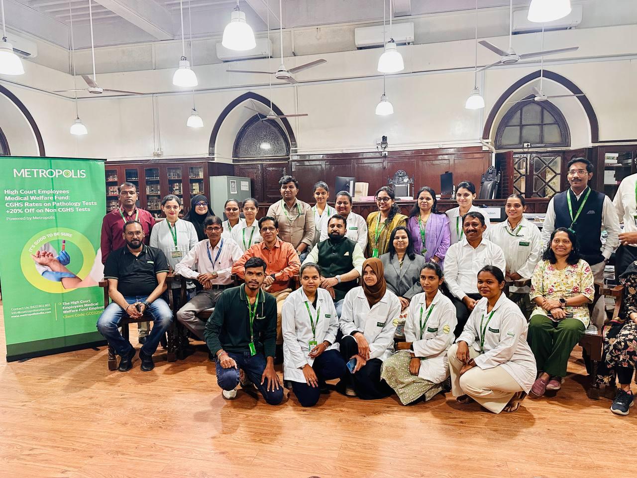 Full group photograph of Metropolis preventive health camp participants